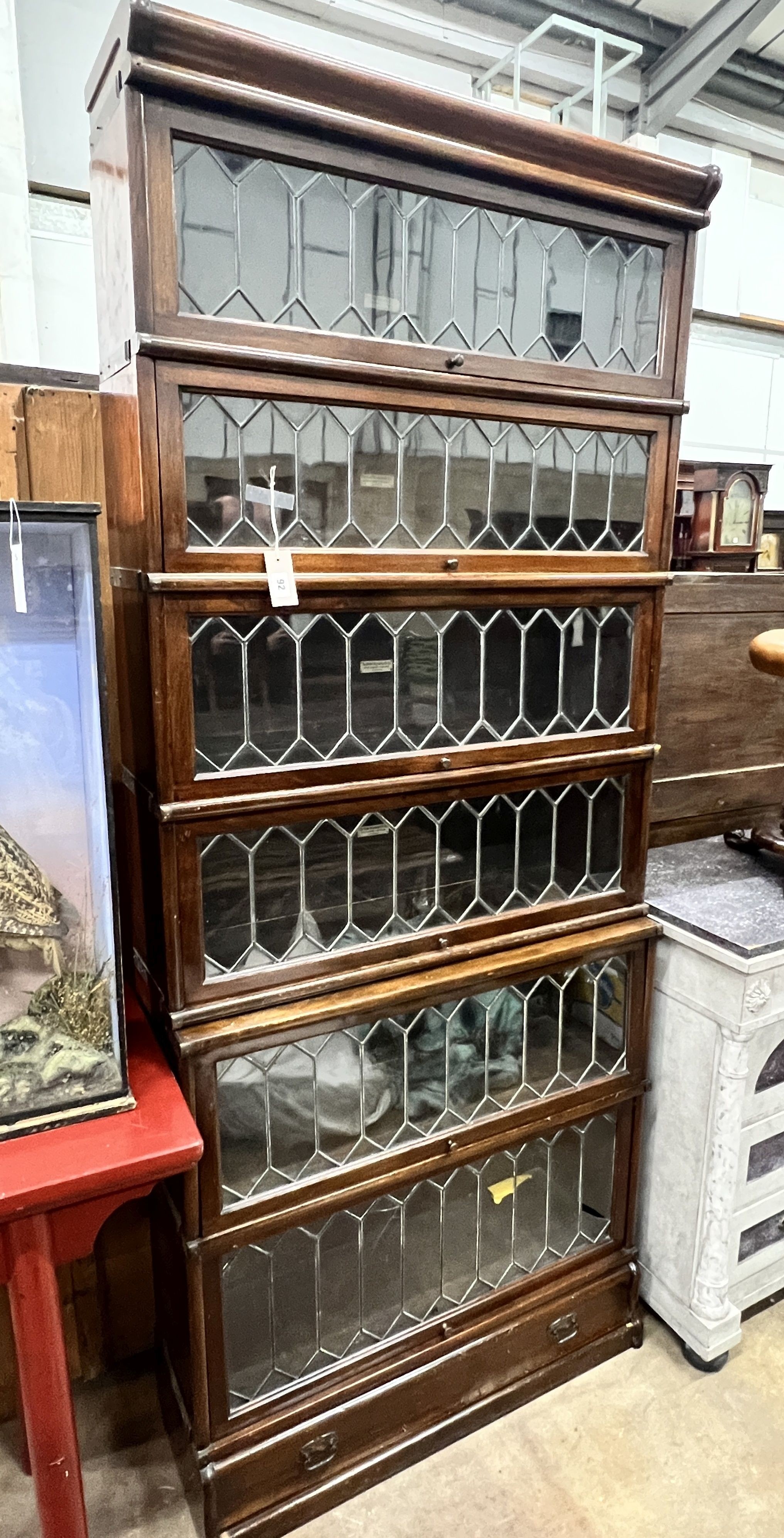 A Globe Wernicke six section mahogany bookcase with leaded glazed doors, length 87cm, depth 29cm, height 206cm